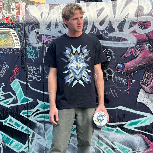 Man Wearing the Hemp Wolf T shirt and holding a Protein Boost Tub