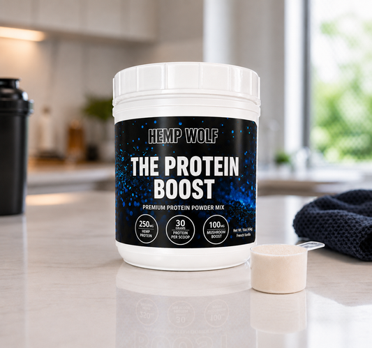 The Protein Boost tub beside a protein scoop on a bright kitchen counter